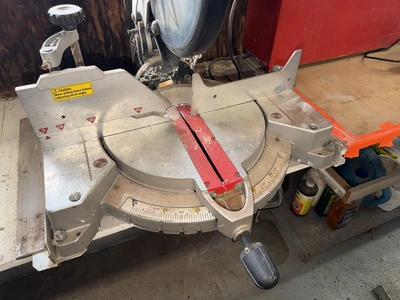 (1) Craftsman 12" compound miter saw, 120V, in working condition.