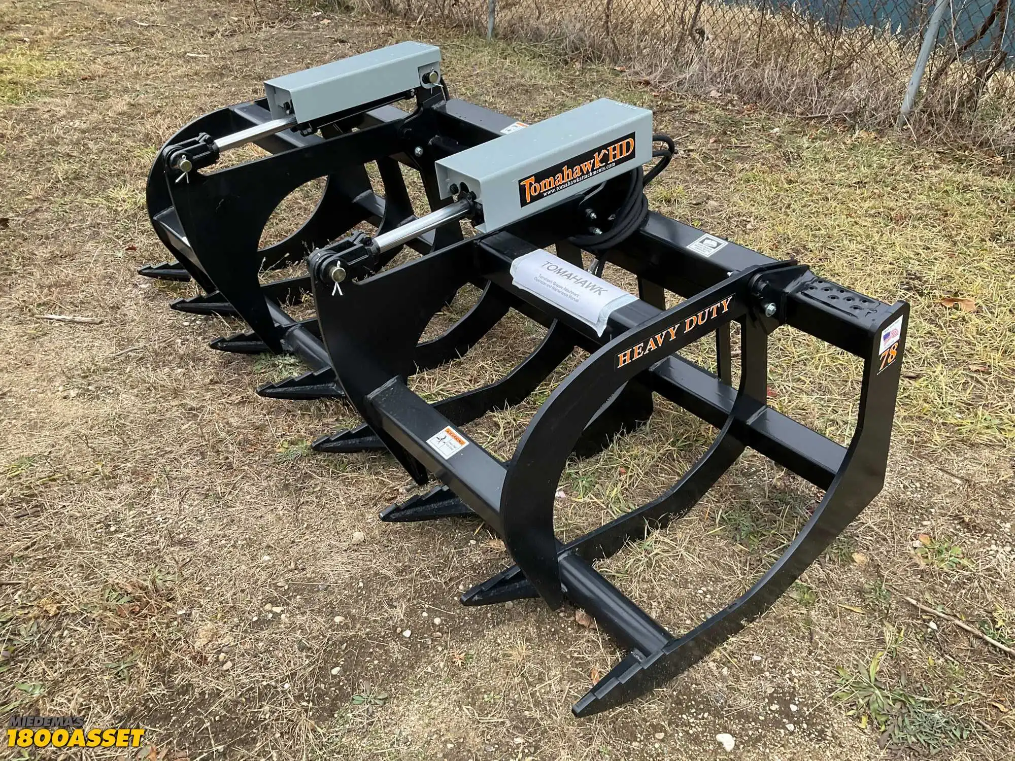 New Tomahawk 78” brush grapple attachment, two hydraulic grapple arms, skid steer quick attach