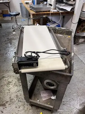 USED CONVEYOR CONVEYOR 31 1/2” LONG BY 11 3/4” WIDE