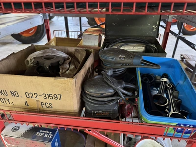 (1) small wire shelf with assorted contents, includes Dremel tool, small battery charger, pneumatic ...