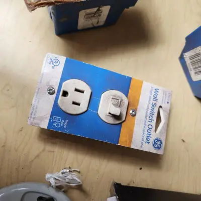 Lot of Electrical Supplies Including Porcelain Pull Chain Lampholders, GE Wall Switch Outlet, and Electrical Boxes