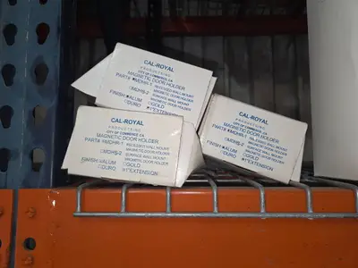 Shelf of magnetic door holders, hose, cords