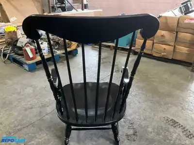 Lot of (2) wooden rocking chairs- brown press back oak rocking chair & black Boston rocker...