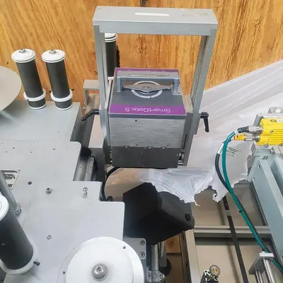 LSI Front and Back Labeler with integrated hold down