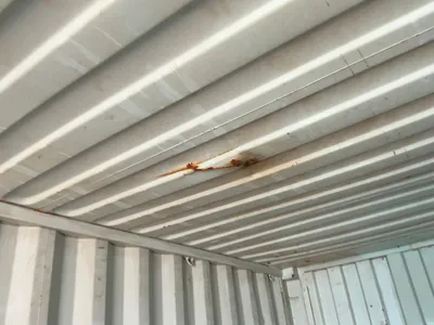 20’ Shipping / Storage Container 8’ wide x 8’ 6” tall, swing doors on one end, wood deck, rings for ...