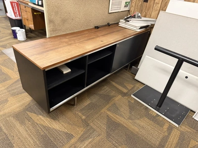 Contents of office furniture, includes (1) 78" wooden desk, (1) credenza, 74" x 18.5", and (2) woode...