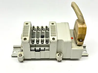 VV5QC11-04N3FD0-S | SMC  Base Mount Plug-In Manifold w/ DIN Rail Brackets - Used