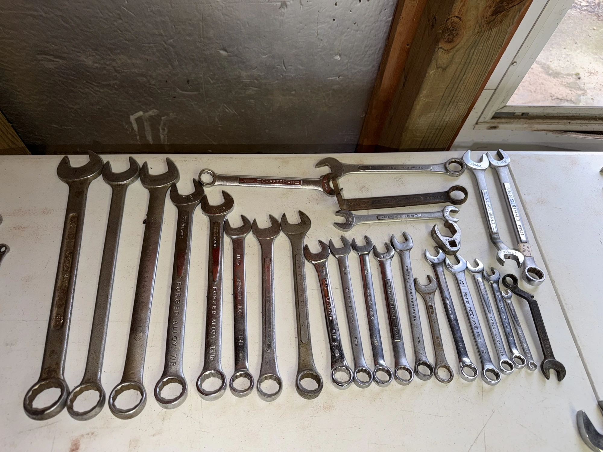 (1) tool box filled with assorted box end wrenches.