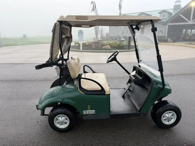 (1) 2015 E-Z-Go golf cart with a Kawasaki gas engine, includes canopy, ball cover, club cover, fold-...