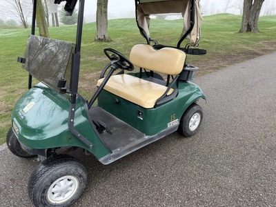 (1) 2015 E-Z-Go golf cart with a Kawasaki gas engine, includes Club canopy, ball washer, fold-down w...
