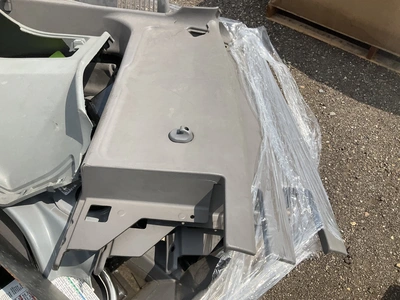 Skid of Kenworth interior parts including dash panels and sleeper cab components, used