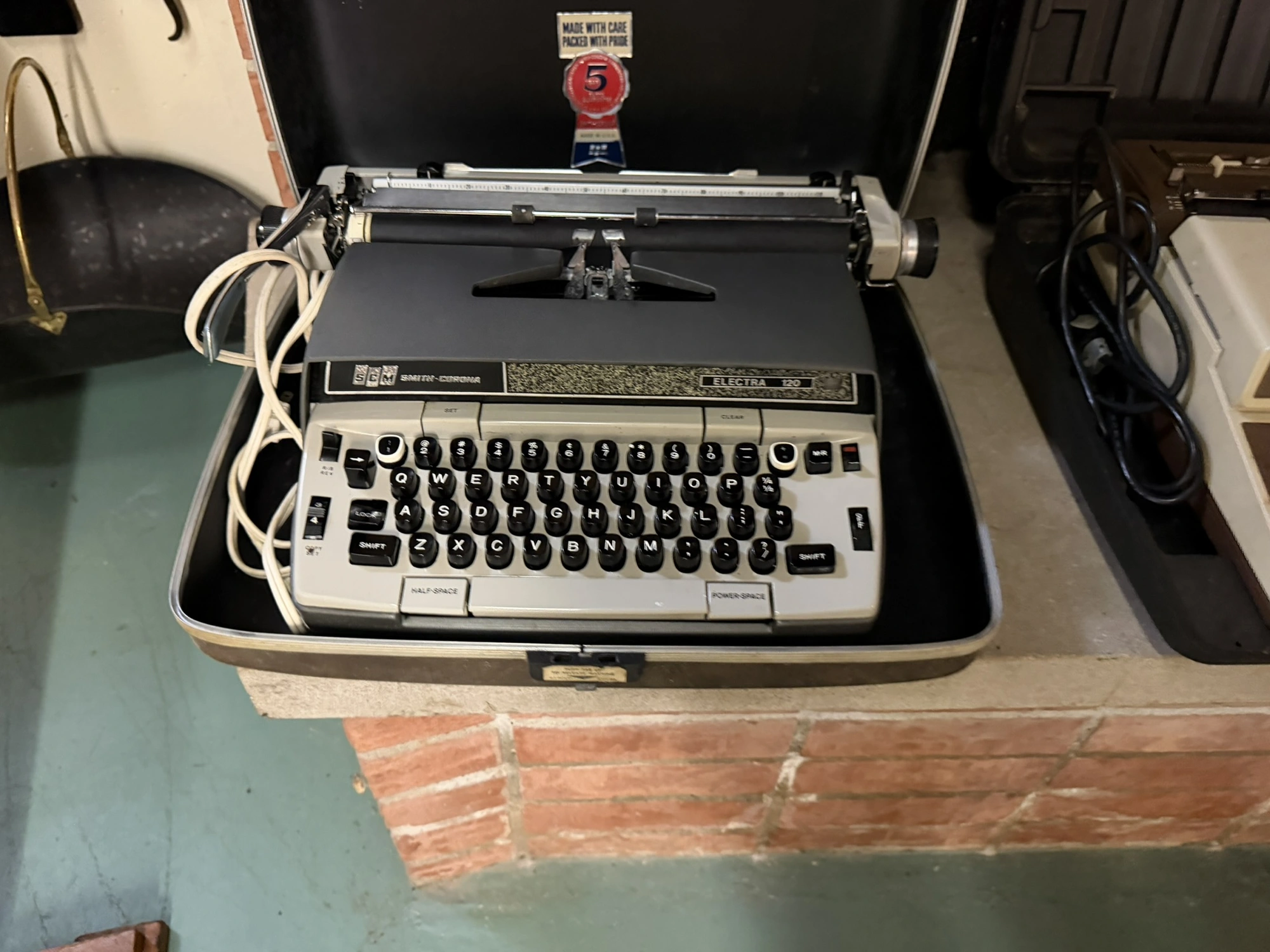 (1) SCM Smith Corona Electra 120 typewriter with case.