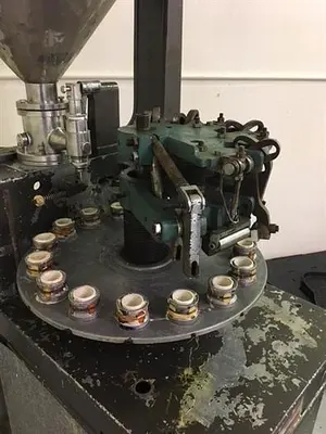 Kalix model KX-60 16-Station Tube filler and sealer