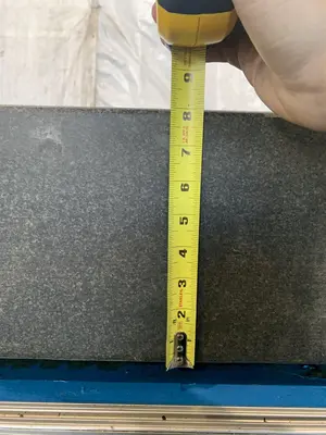 60" X 60" X 8-1/4" GRANITE SURFACE TABLE. STOCK # 1165023.