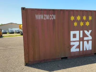 20’ Shipping / Storage Container 8’ wide x 8’ 6” tall, swing doors on one end, wood deck, rings for ...