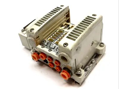 USED SMC PLUG-IN VALVE MANIFOLD BASE MISSING PORT