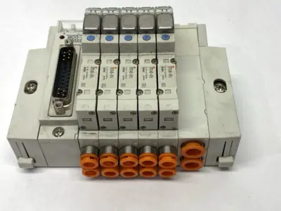 USED SMC PNEUMATIC MANIFOLD ASSEMBLY 5 STATIONS 1/4" PORTS 24VDC