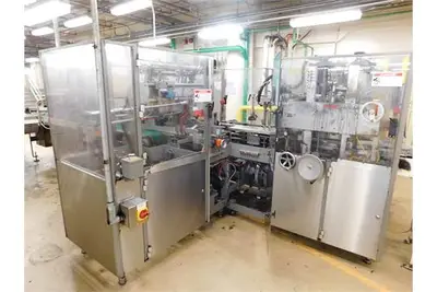 Douglas case packer with controls and magazine