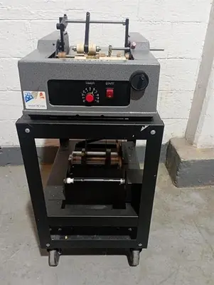 Advent model 310 semi-automatic pressure sensitive wraparound labeler