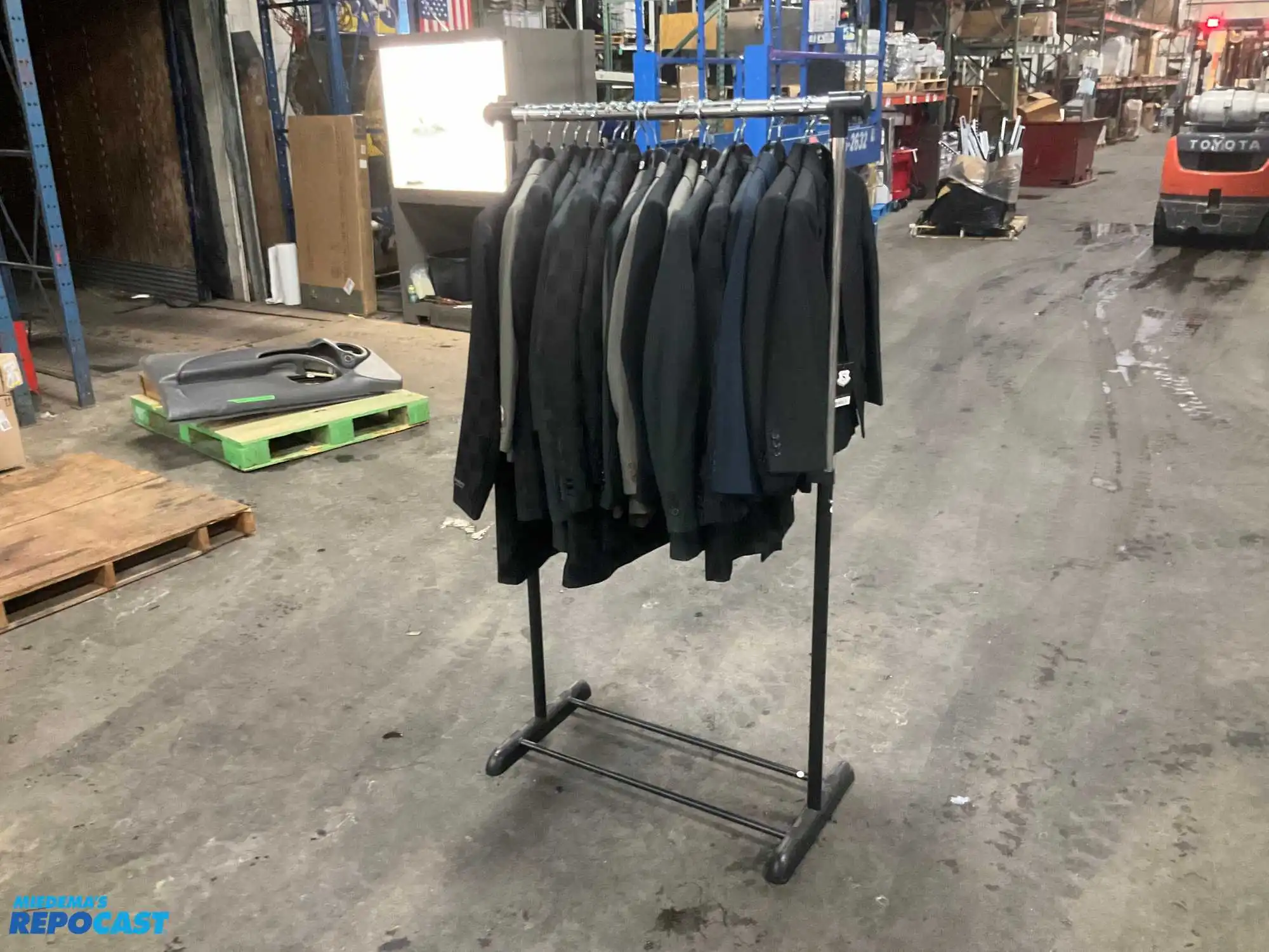 Lot of (21) assorted size youth suit coats and rack
