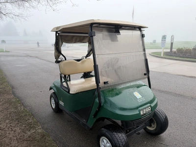 (1) 2015 E-Z-Go golf cart with a Kawasaki gas engine, includes canopy, ball cover, club cover, fold-...