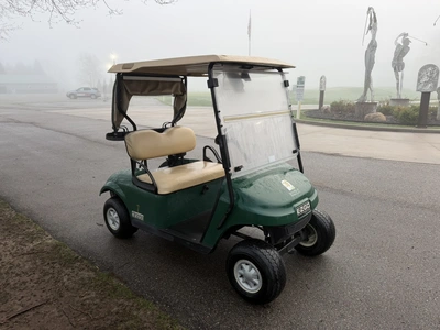 (1) 2015 E-Z-Go golf cart with a Kawasaki gas engine, includes canopy, ball cover, club cover, fold-...