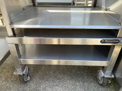 Used Wasserstrom Used 25" Wasserstrom Stainless Steel Storage Shelves with Caster Wheels - SS154 Racks/Shelving Illinois US | Falcon Restaurant Supply #1375941