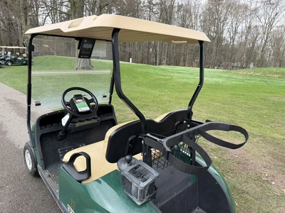 (1) 2015 E-Z-Go golf cart with a Kawasaki gas engine, does not include Club canopy, includes ball wa...