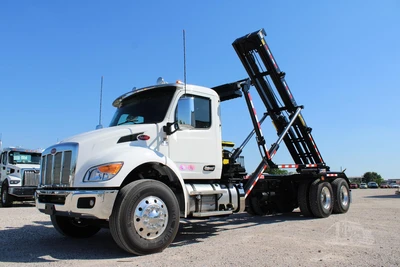 New | in-Stock 2027 PETERBILT 548 Hooklifts & Roll-Offs Texas US | Roll Off Truck World #1492004