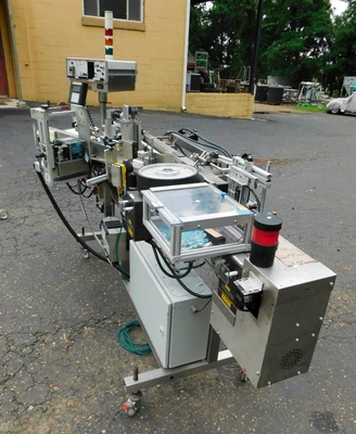 USED NEWMAN WRAP AROUND LABELER NV II