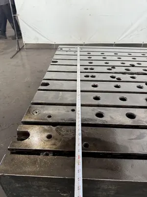 60" WIDE X 67" LONG X 9" THICK T-SLOTTED BOLSTER PLATE. STOCK # 1006324