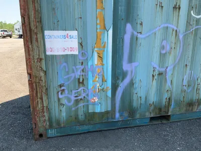 20’ Shipping / Storage Container 8’ wide x 8’ 6” tall, swing doors on one end, wood deck, rings for ...
