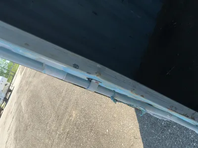 20’ Shipping / Storage Container 8’ wide x 8’ 6” tall, swing doors on one end, wood deck, rings for ...