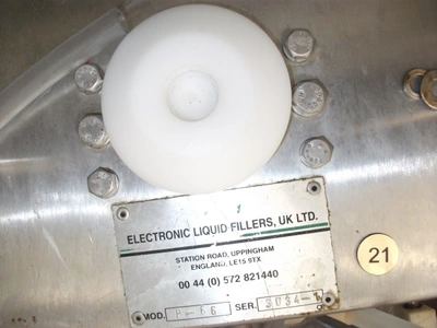 6 Head ELF Filler with feed tanks & container link belt conveyor