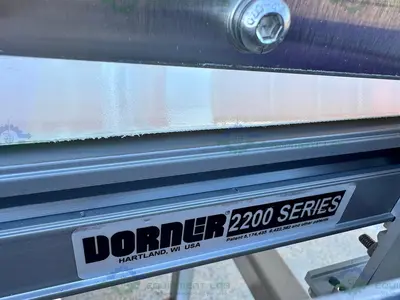 USED DORNER STAINLESS STEEL CONVEYOR INSPECTION MACHINE W/ OPTEL CONTROLLER