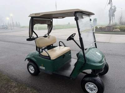 (1) 2015 E-Z-Go golf cart with a Kawasaki gas engine, includes canopy, ball cover, club cover, fold-...