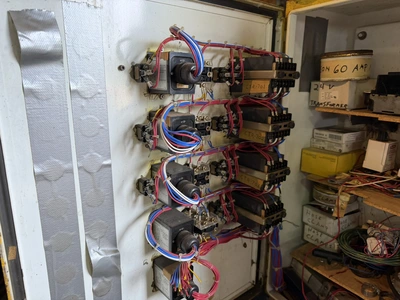 (1) control cabinet filled with assorted electrical items, includes screws, wire, terminals, hose cl...