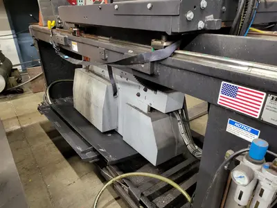 HE&M Vertical Bandsaw V100LM-45 with Infeed/Outfeed Conveyors