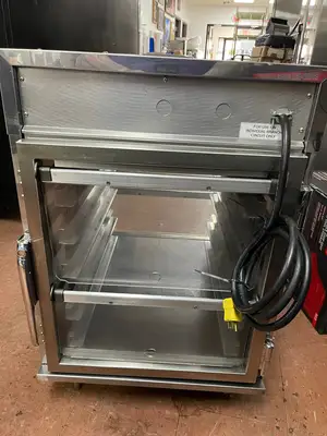 Used Henny Penny Used Henny Penny HC-903 CDT Heated Holding Pass Thru Cabinet with Flip Doors and Timers 120V Hot Food Warming, Holding, & Transport Cabinets Illinois US | Falcon Restaurant Supply #1375758