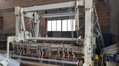 USED 2001 TOSCHI TWO DRUM TISSUE SLITTER REWINDER