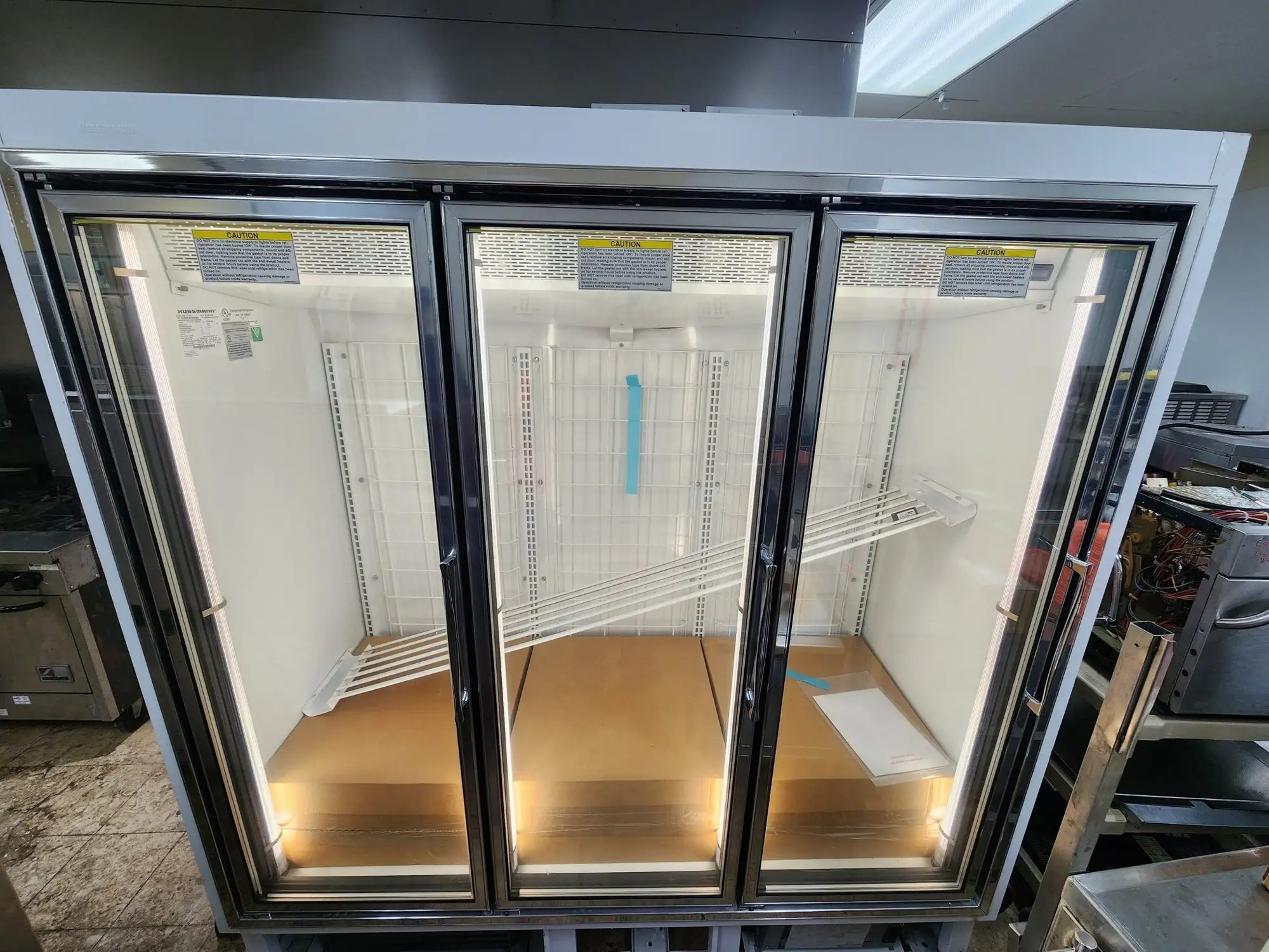 New | in-Stock Hussmann New Hussmann HGL-3-BS 3 Door Reach-In Cooler Merchandising Freezer Display Freezers Illinois US | Falcon Restaurant Supply #1376663