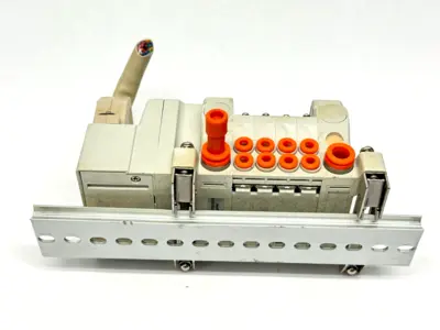 VV5QC11-04N3FD0-S | SMC  Base Mount Plug-In Manifold w/ DIN Rail Brackets - Used