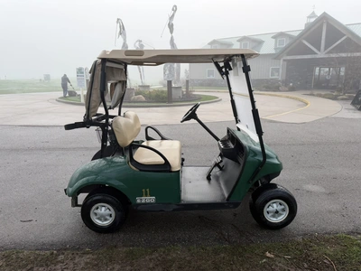 (1) 2015 E-Z-Go golf cart with a Kawasaki gas engine, includes canopy, ball cover, club cover, fold-...