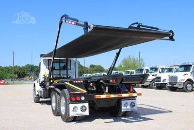 New | in-Stock 2027 PETERBILT 548 Hooklifts & Roll-Offs Texas US | Roll Off Truck World #1492004