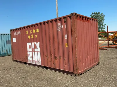 20’ Shipping / Storage Container 8’ wide x 8’ 6” tall, swing doors on one end, wood deck, rings for ...