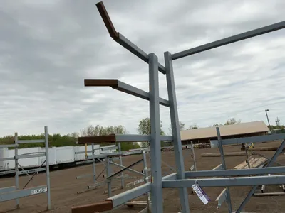 Metal 8-Tier Cantilever Rack, welded together, arms stick out approx. 20” and have metal brackets th...