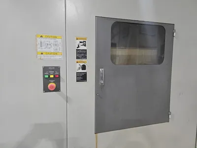 Hyundai HI-V50D VMC w/ 30-Slot ATC, Conveyor, (2) Kurt Vise, Fanuc Oi-MC Controller