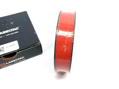 USED LABELTAC PRO MODEL HIGH PERF. 10 YEAR VINYL LABEL 1" X 150' /ROLL, RED