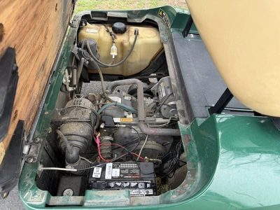 (1) 2015 E-Z-Go golf cart with a Kawasaki gas engine, does not include Club canopy, includes ball wa...