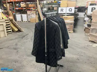Lot of (21) assorted size youth suit coats and rack
